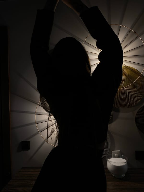 Woman poses with decorative lighting installation in Votkinsk interior