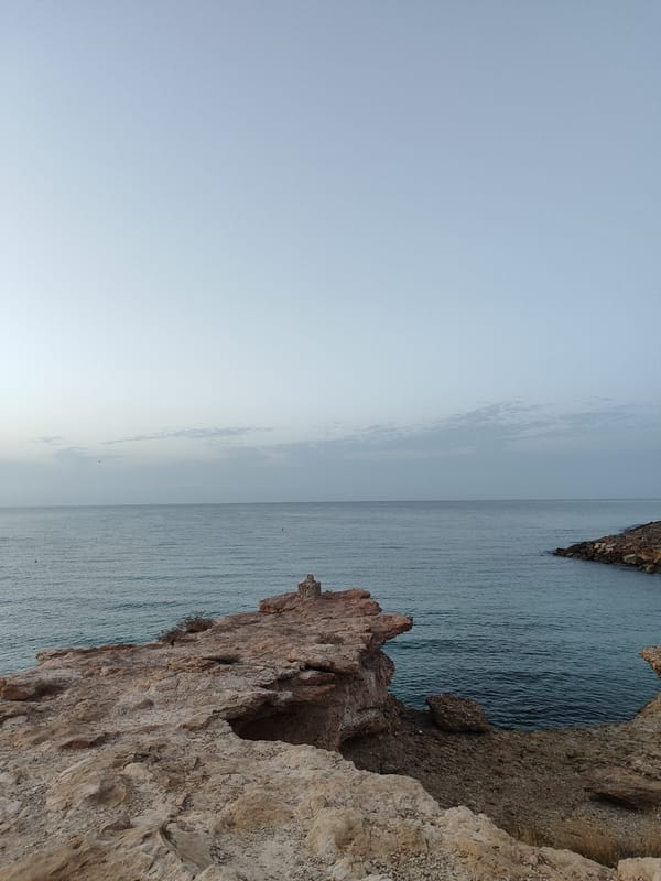 El Campello's marina and historic watchtower at dawn