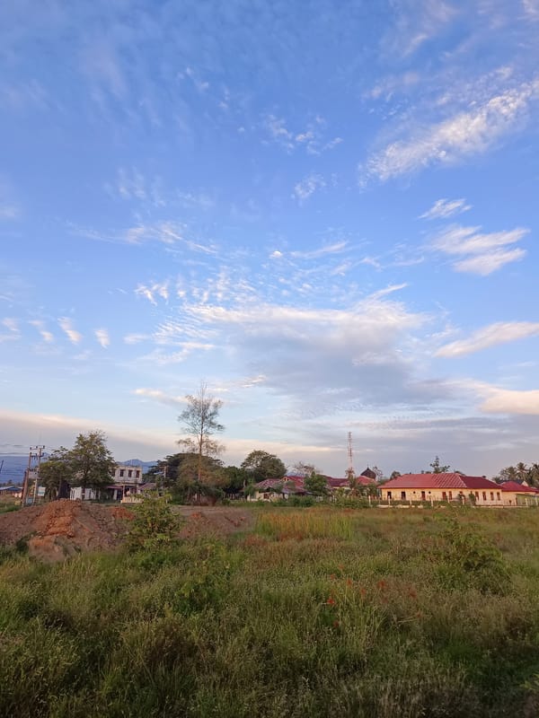 Sunset over the fields and roads of Meunasah Raya