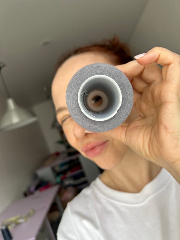 Woman takes selfies with crafting supplies in Chaikovsky apartment
