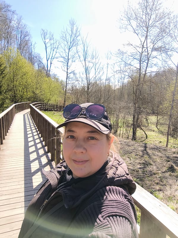 Woman documents spring nature walk in Moscow park