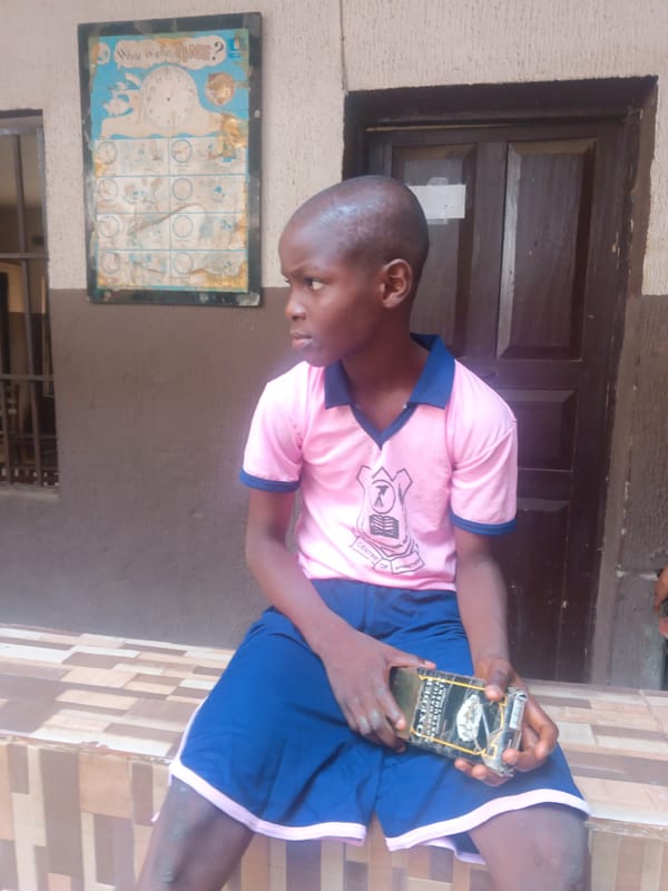 Children gather outdoors in Nkpor, Nigeria