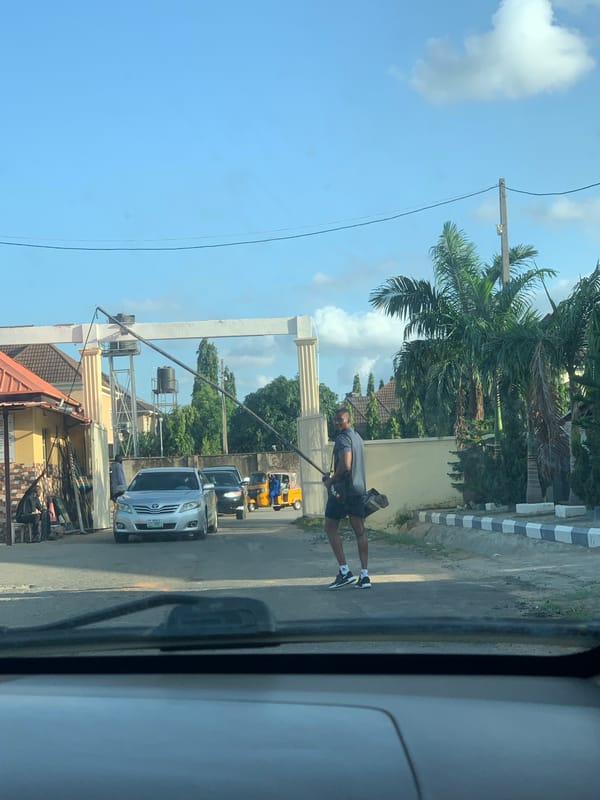 Everyday street life along a busy Abuja road