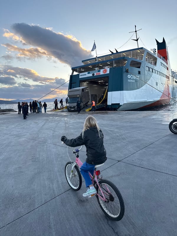 Children play at Aegina Port harbor during afternoon