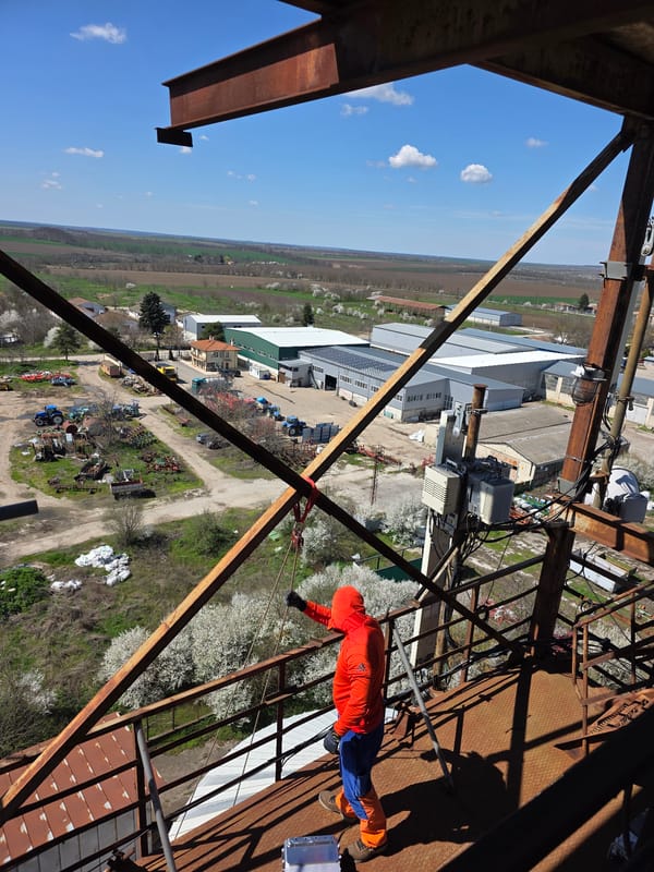 Worker maintains telecommunications tower in Krushari, Bulgaria
