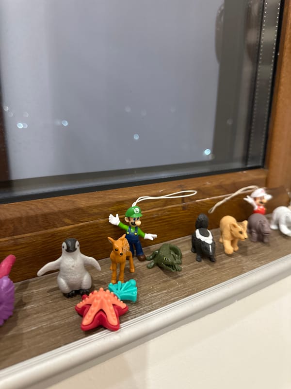 Toy figurine collection displayed on windowsill in Lovech