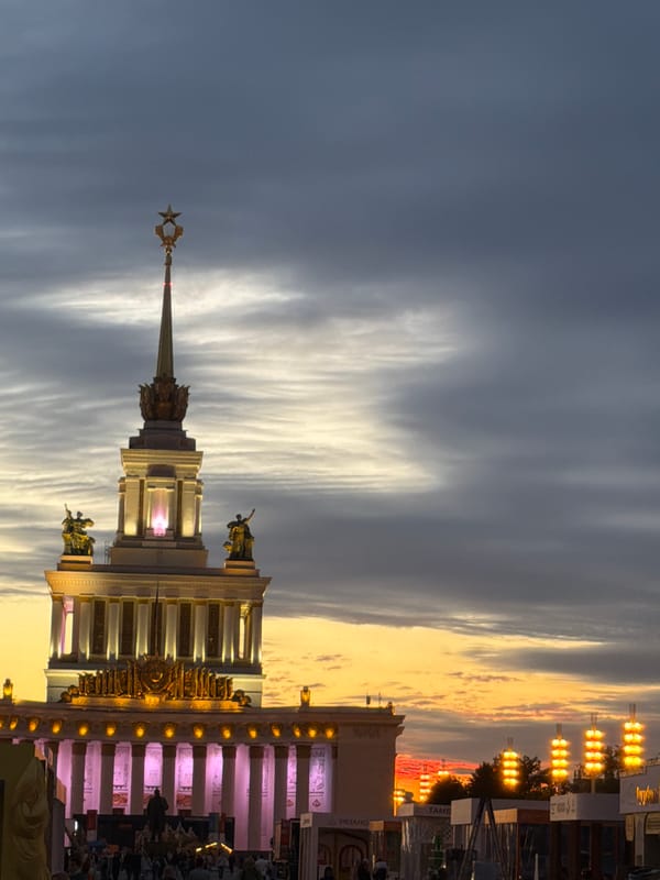 Festival gathering in public plaza with performances and illuminated displays