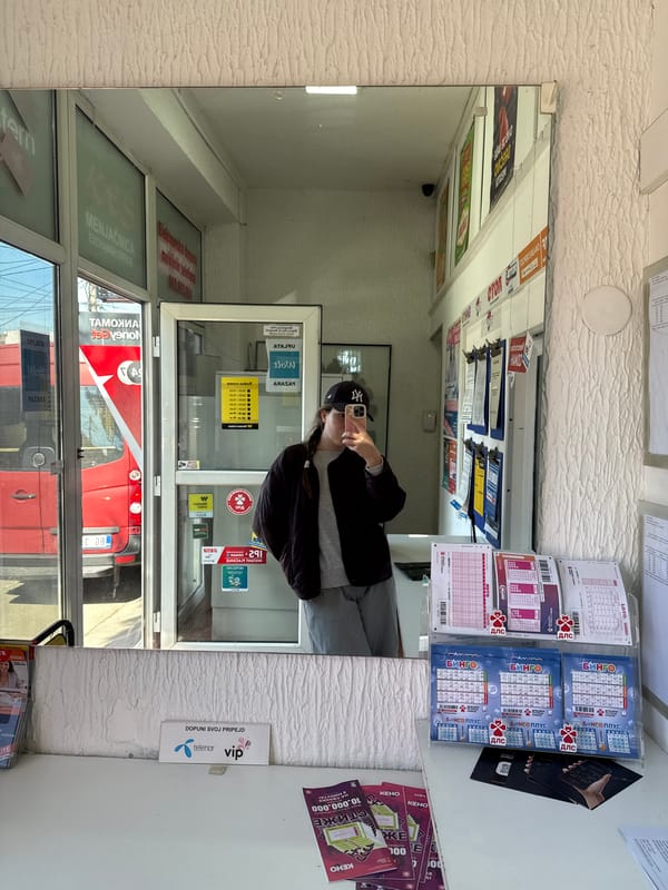 Woman takes selfie in Belgrade shop mirror