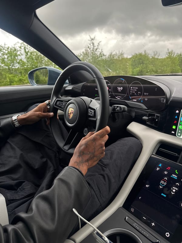 Couple photographed inside Porsche Taycan in French countryside