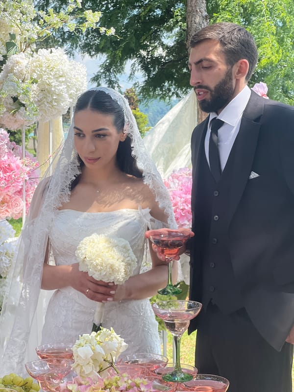 Outdoor wedding ceremony and reception held near waterfront location