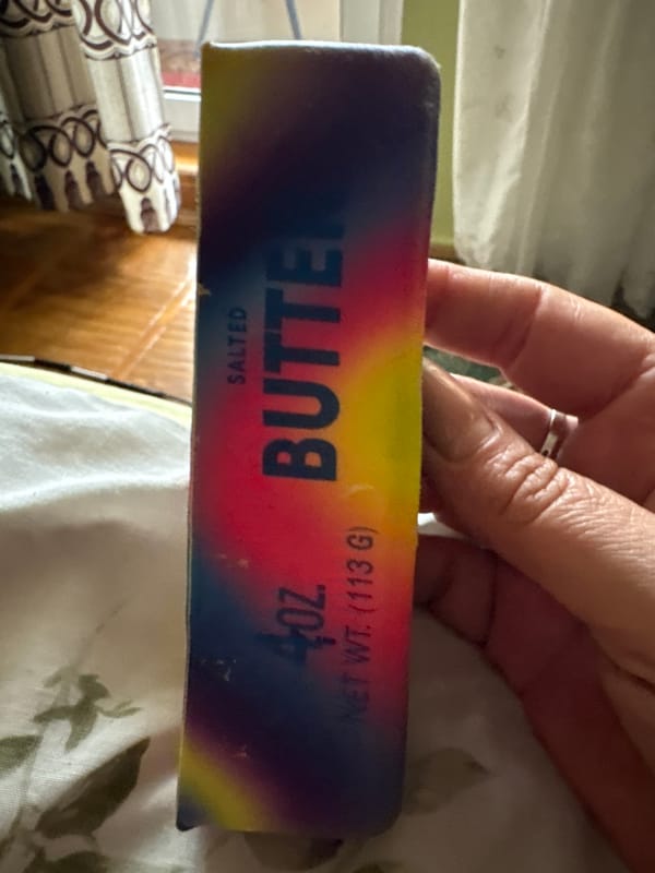 Rainbow butter novelties and a flag-colored plush in Kalush