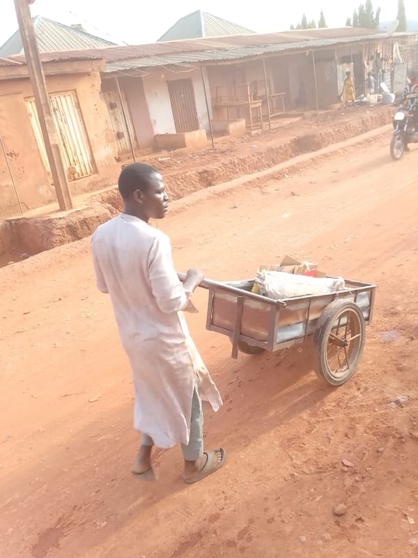 Daily life unfolds on dirt streets in Yelwa, Nigeria