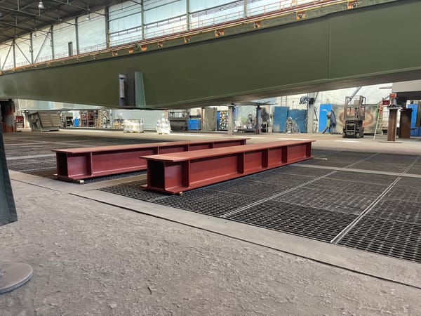 Industrial facility interior with steel beams documented