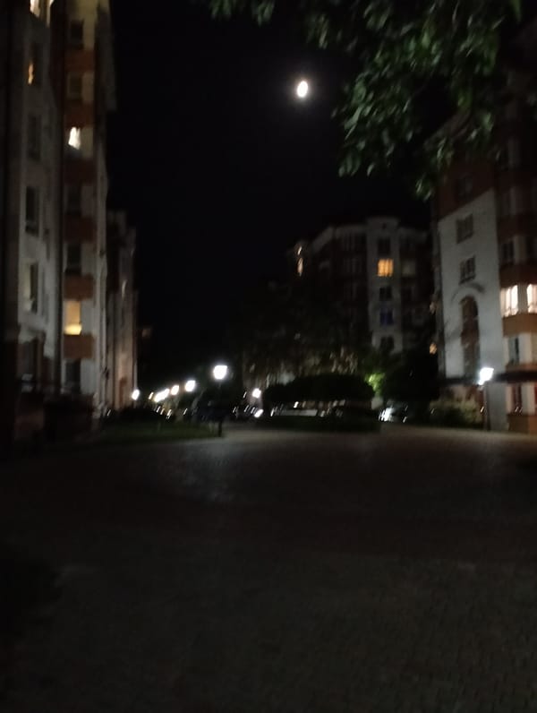 Nighttime documentation of quiet Krykhivtsi streets and buildings