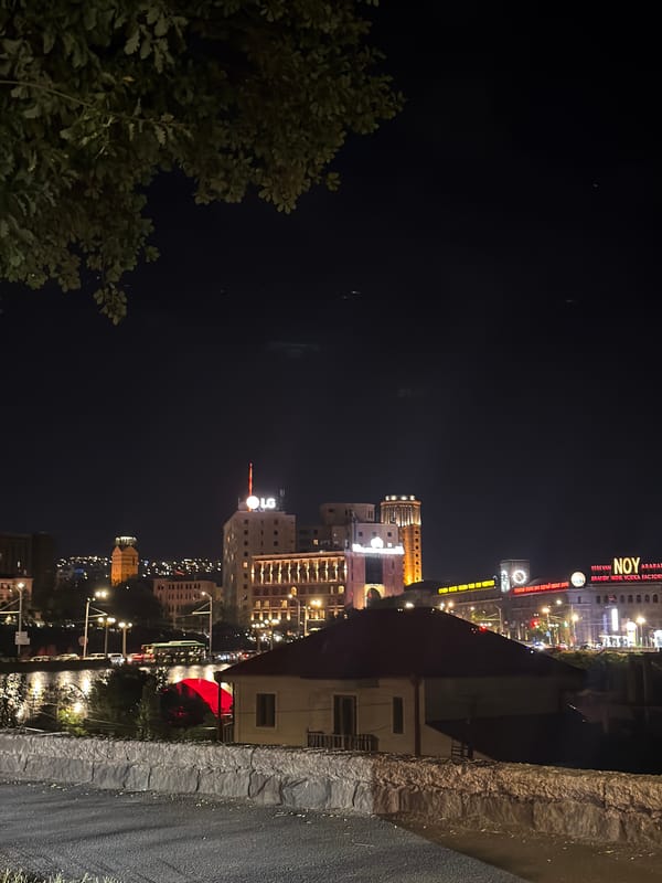 Evening drive through Yerevan past Republic Square and Ararat signs