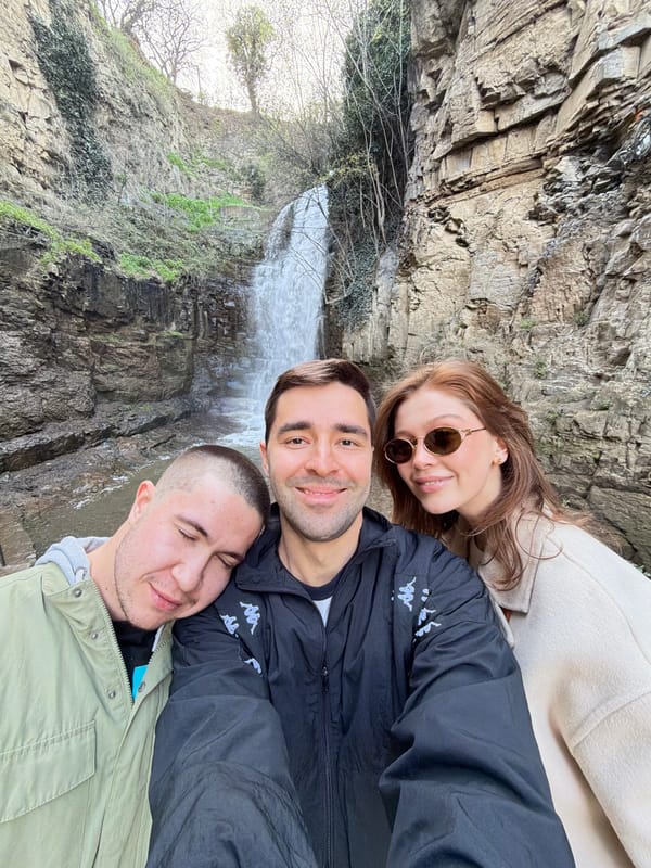 Tourists photograph themselves at Tbilisi waterfall viewing platform