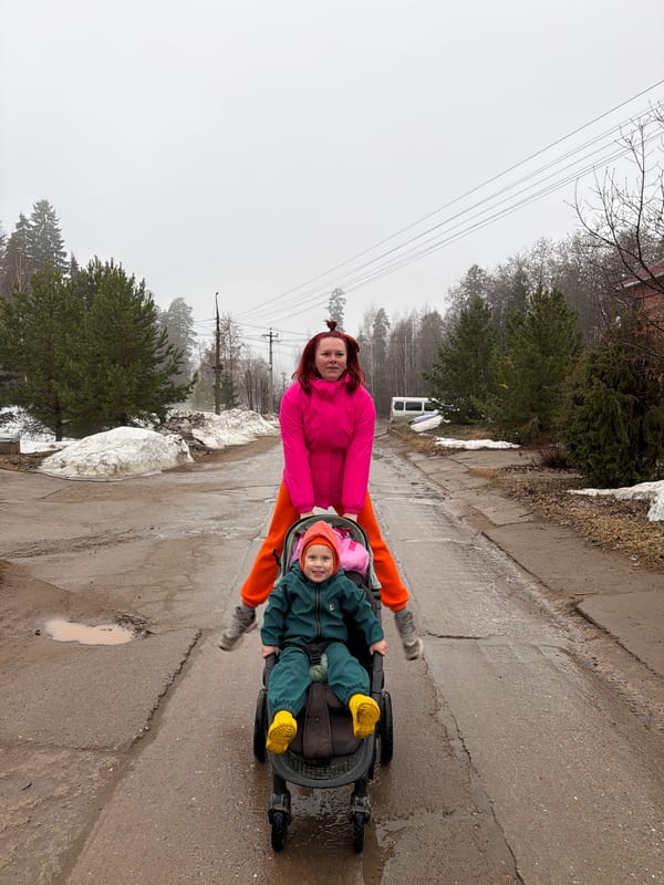 Woman rides wheeled vehicles on wet roads in Chaikovsky