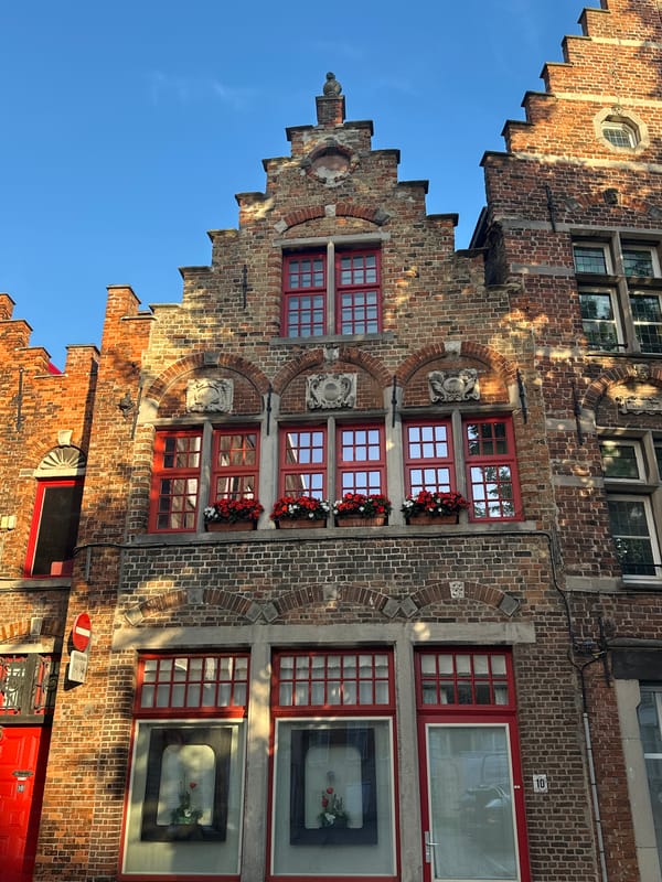 Historic streets and squares of Bruges on a clear evening