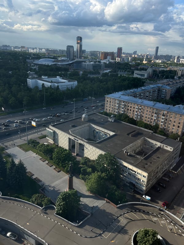Tourist documents Moscow landmarks and infrastructure during afternoon visit