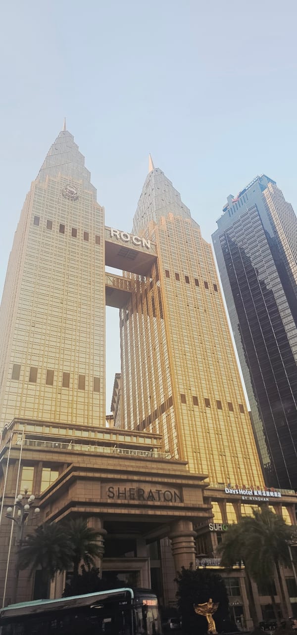 Chongqing's golden Sheraton tower from three street-level angles