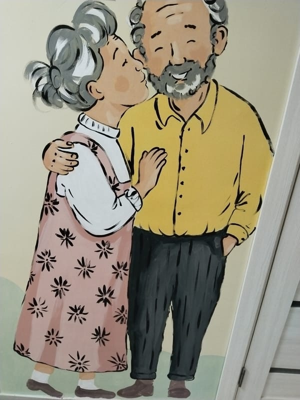 Cartoon couple painting and Russian greeting text observed