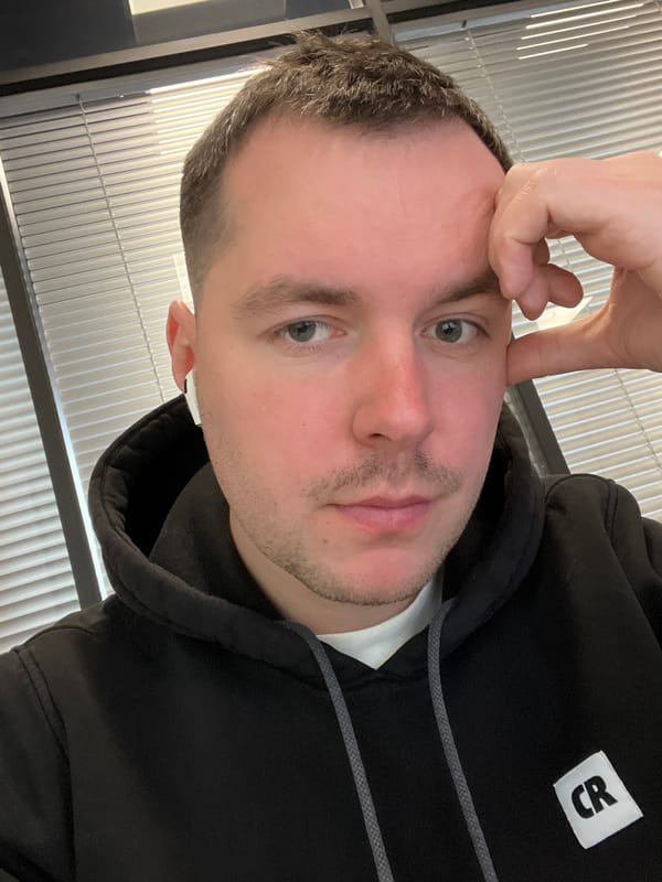 Man takes indoor selfie in Moscow wearing black hoodie