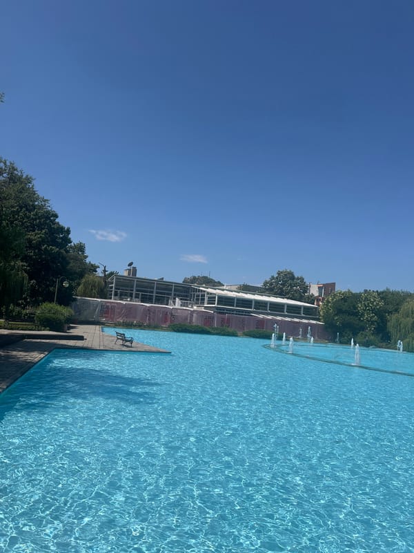 Sunny morning at Plovdiv's fountain pool and tree-lined surroundings