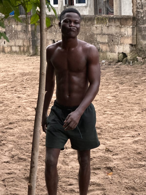 Pickup soccer on a sandy lot in Badagry, Nigeria