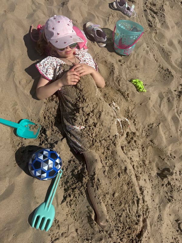 Family enjoys afternoon beach outing in Valencia, Spain