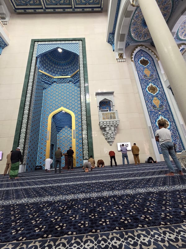 Prayer and daily rituals inside an ornate mosque
