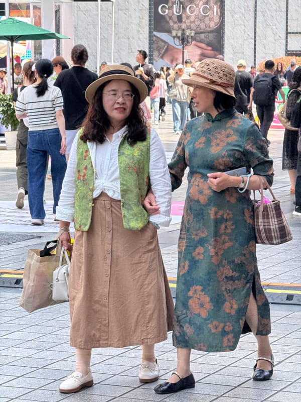 Busy street scene with Tesla Cybertruck, coffee truck in Yuzhong
