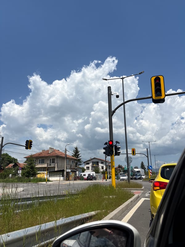 Urban intersection with red traffic lights captured from vehicle