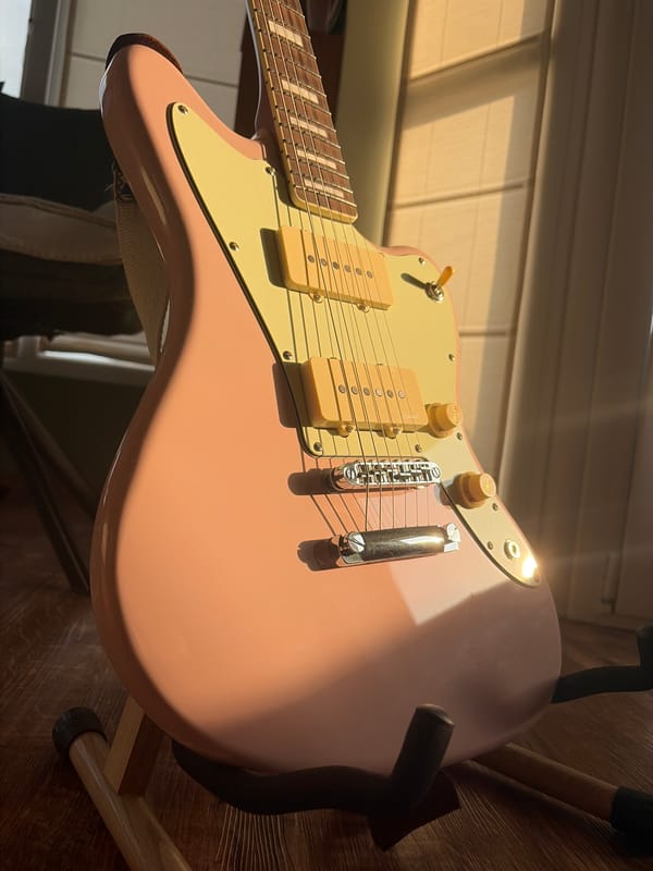 Mixed memories captured: pink guitar, urban sunset, woman portrait