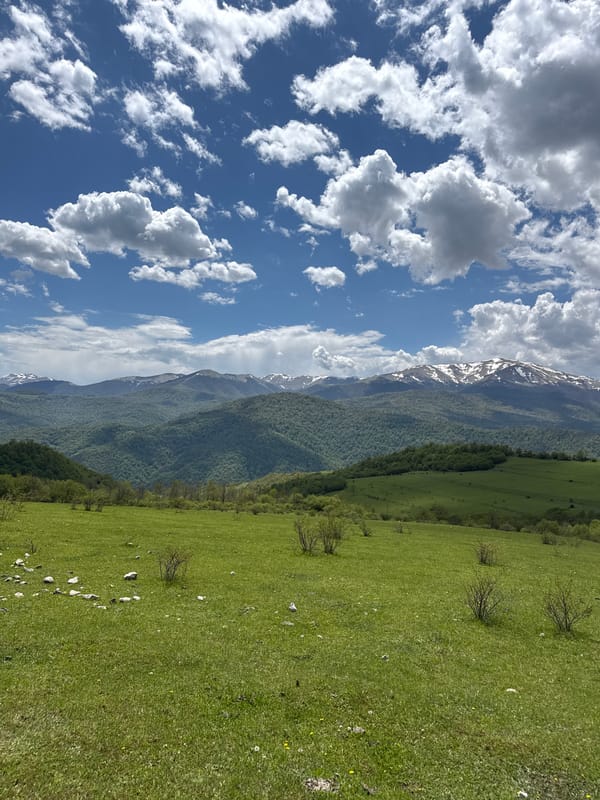 Horseback riders observed in Armenian mountain countryside