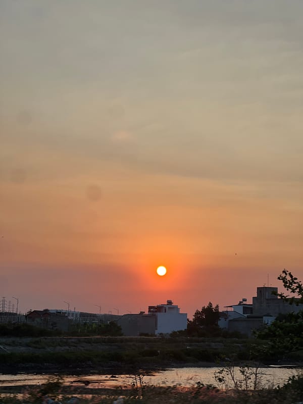 Orange sunset captured over urban Nha Trang, Vietnam