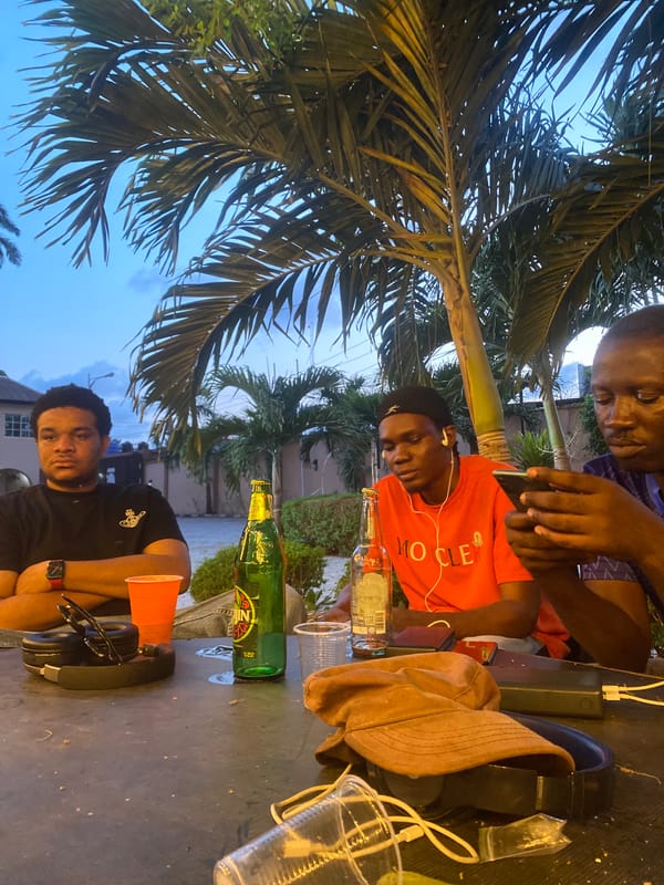 Evening social gathering under lights in Alagba, Nigeria