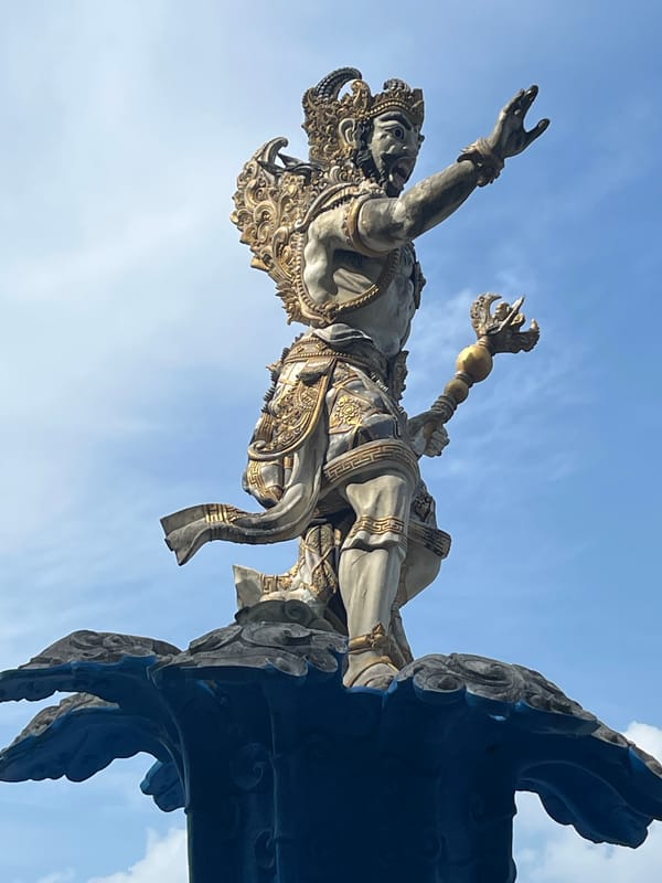 Tourist documents Hindu statues and scenic views in Kuta Selatan
