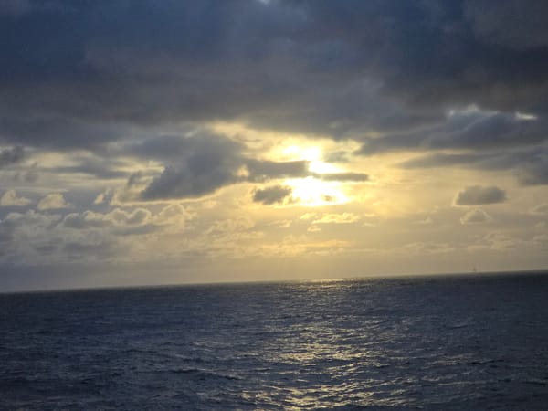 Dramatic sunset breaks through clouds over Norwegian coast