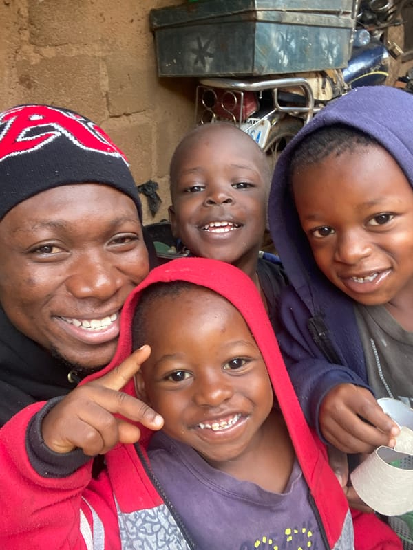 Kids posing and goofing around outside in Jos, Nigeria