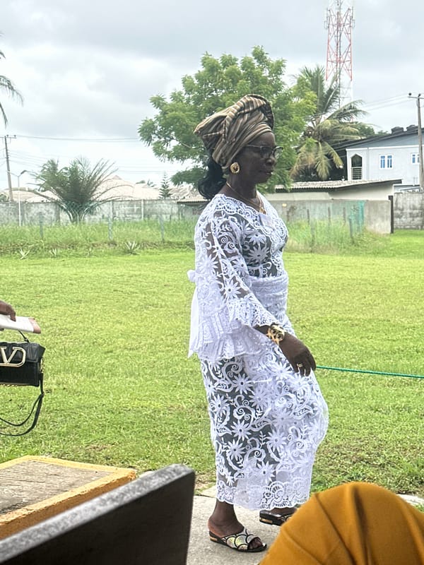 Formal outdoor ceremony underway at a pavilion in Itoga, Nigeria
