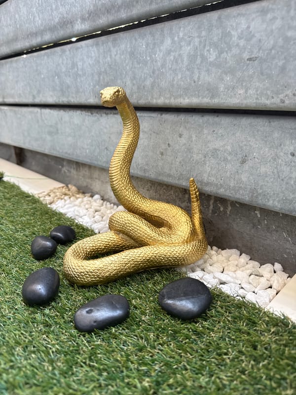 Ornamental garden display with figurines on artificial grass in Sofia