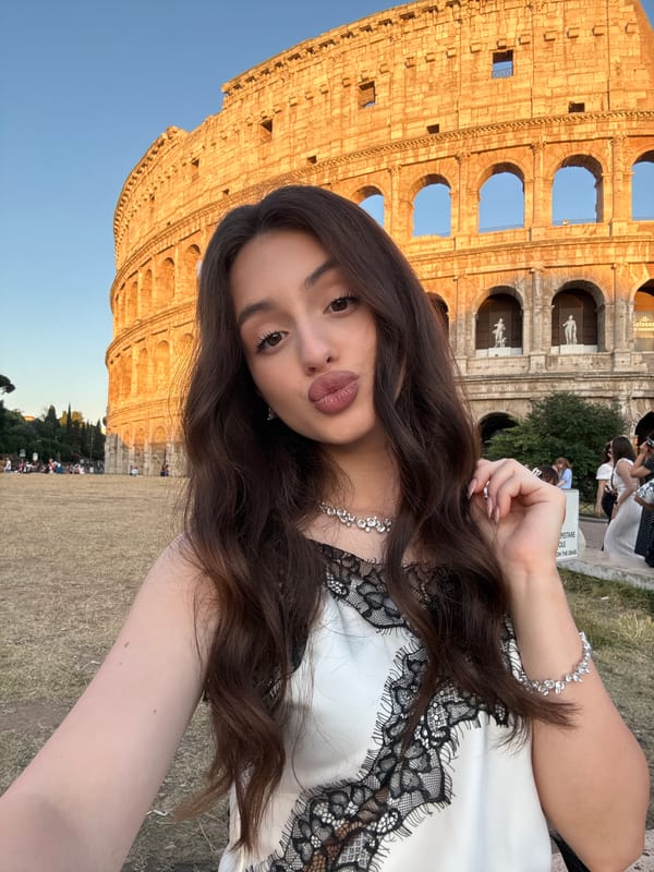 Tourist takes sunset selfie at Rome's Colosseum