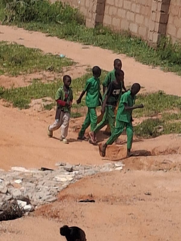 Morning foot traffic on a dusty Tumfure path
