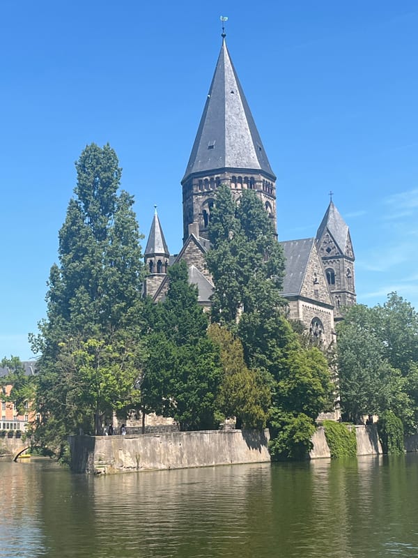 Canal boat Aurora docked near Temple Neuf in Metz