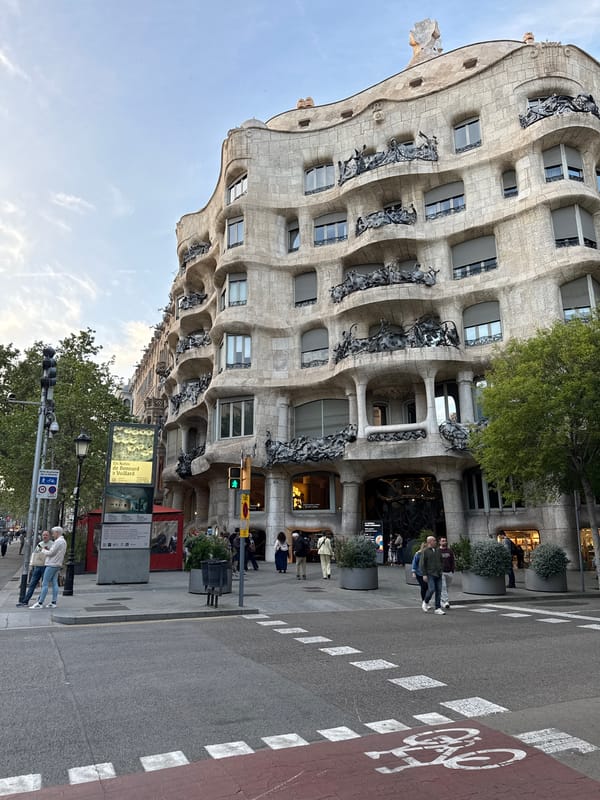 Tourist documents Gaudí's Casa Milà and shopping in Barcelona