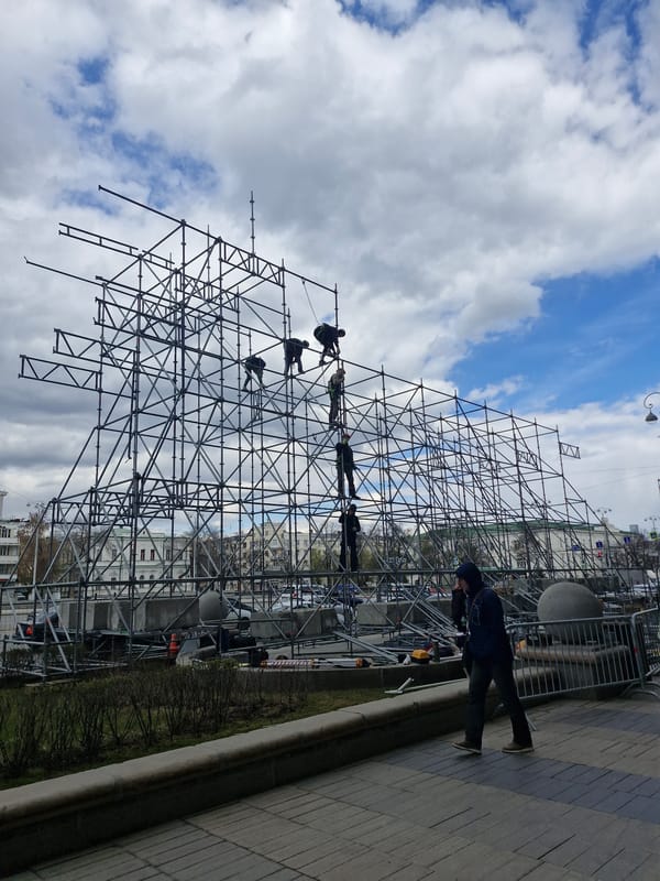 Workers active on metal scaffolding structure in Yekaterinburg