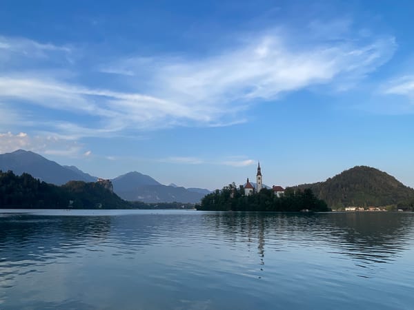 Peaceful lake views with a church island on the horizon