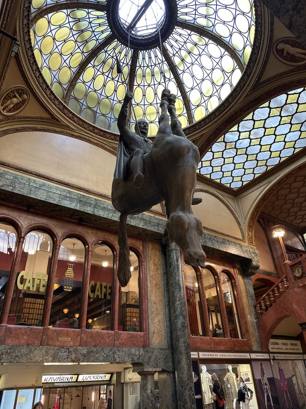 Černý's inverted horse sculpture observed at Prague's Lucerna Palace