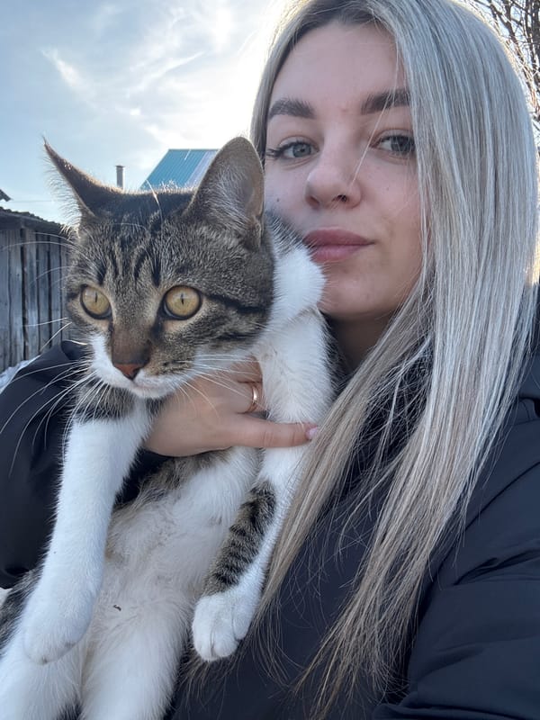 Cat and woman photographed in Russian village