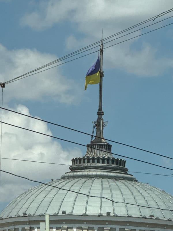 Ukrainian flag flies over a rooftop in Odesa